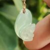 a hand holding a jade necklace - Squirrel Premium Quality with 18k Gold Clasp