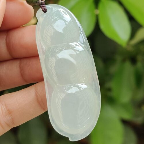 a hand holding a transparent object - Bean with Bat