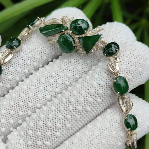 a hand holding a bracelet - 10 Dark Green Cabochons