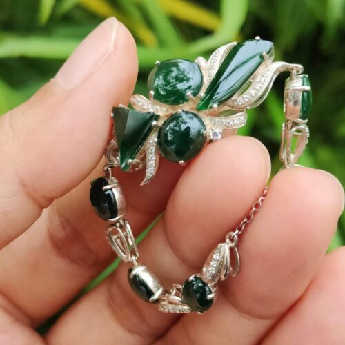 a hand holding a bracelet - 10 Dark Green Cabochons