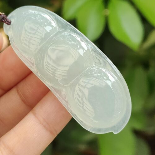 a hand holding a clear object - Bean with Bat