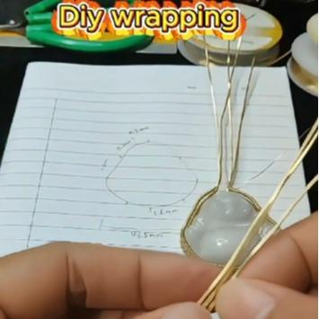 a person holding a wire - Milo Buddha