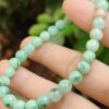 a hand holding a beaded necklace - Light Green Spicy Green Patches Bracelet
