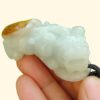 Pixiu Jadeite Carving Pixiu wtih light green and yellow skin with reddish brown pendant side view certified YPQ 2025 at meragi park simei hdb area cover with background pixiu - 8