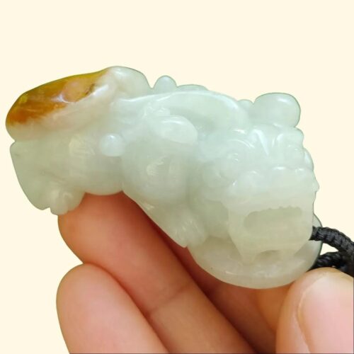 Pixiu Jadeite Carving Pixiu wtih light green and yellow skin with reddish brown pendant side view certified YPQ 2025 at meragi park simei hdb area cover with background pixiu - 8