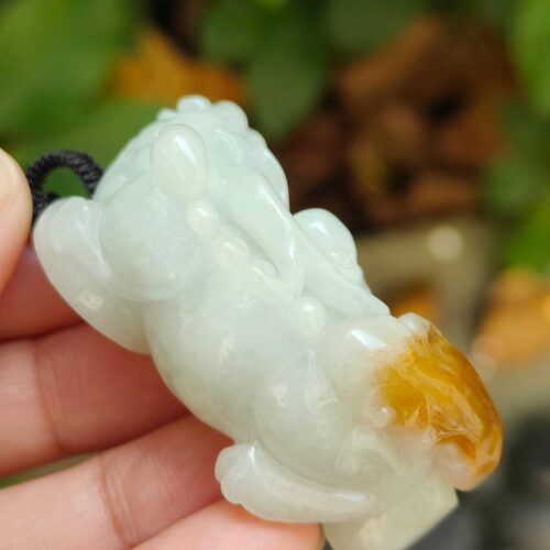 Pixiu wtih light green and yellow skin with reddish brown pendant side view certified YPQ 2025 at meragi park simei hdb area